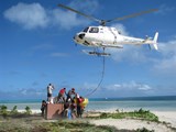 Spreading rat bait by helicopter.